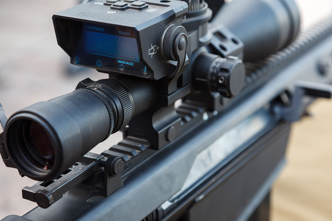 Sniper gun, optics scopes close up. Elements of the sniper rifle with tactical body . Selective focus
