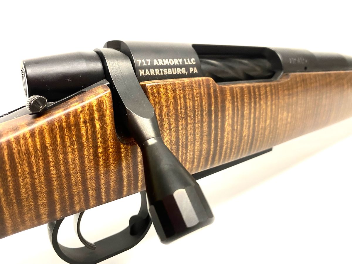Bolt action engraved 717 Armory LLC, Harrisburg PA, on a figured wood stock