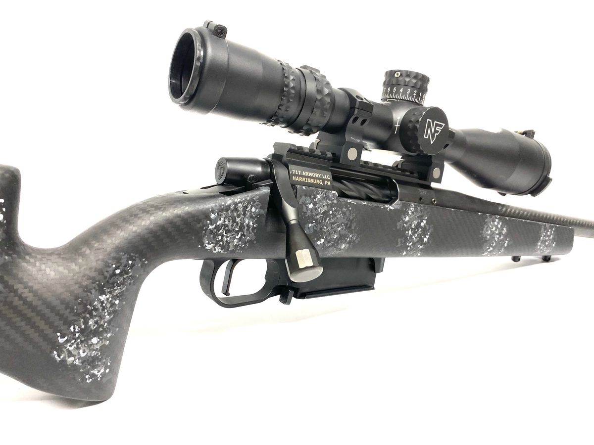 Custom rifle with a carbon-fiber stock and a riflescope