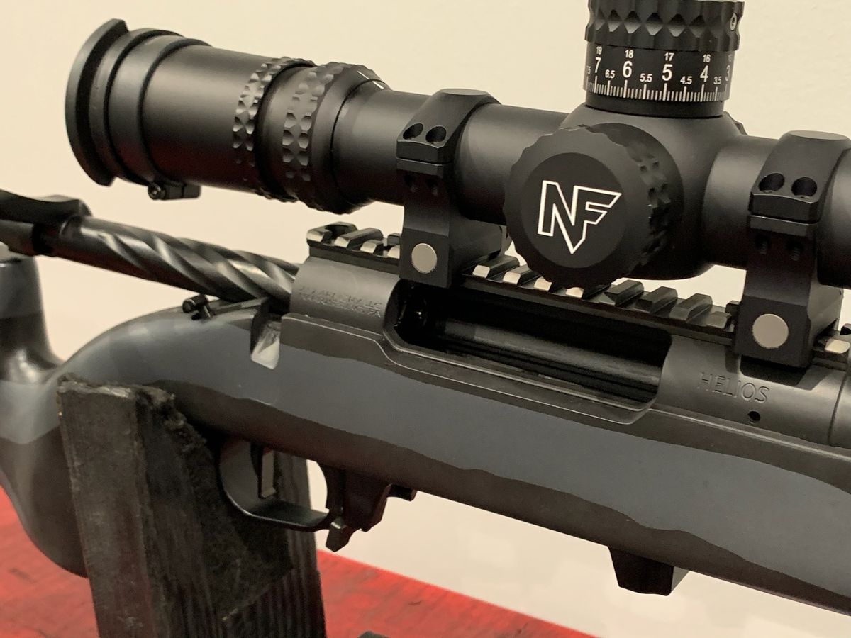 Close-up of a riflescope mounted on a custom rifle